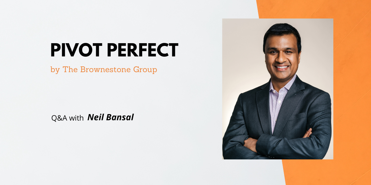Orange and grey banner image of The Brownestone Group's Pivot Perfect interview with Neil Bansal who is wearing a navy suit with his arms crossed and a smile