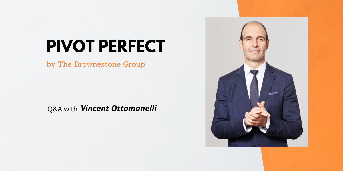 Orange and grey banner image of The Brownestone Group's Pivot Perfect interview with Vincent Ottomanelli who is wearing a navy suit with his hands clasper in front of him